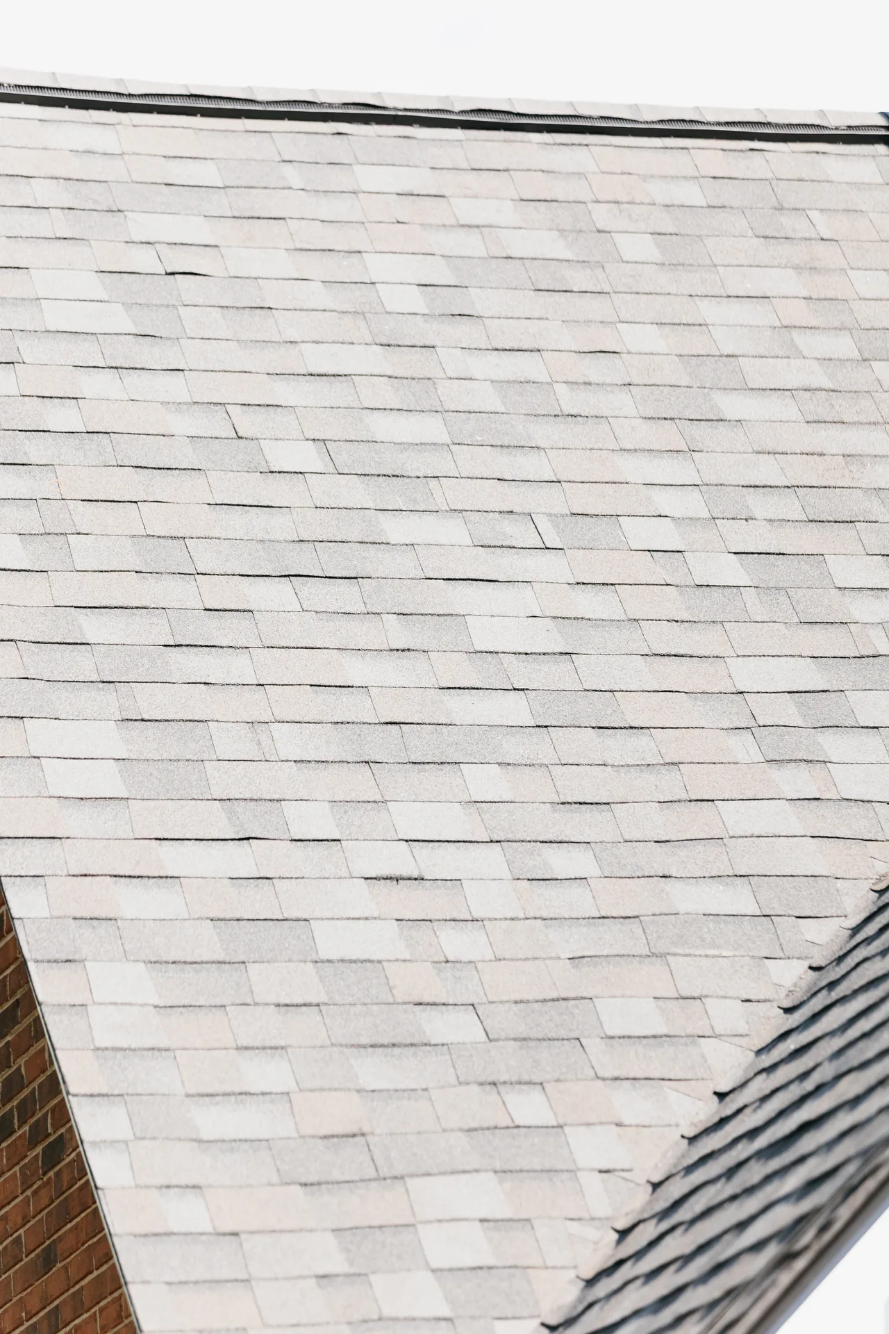 Newly completed insured roof replacement on an Atlanta home protected by comprehensive roofing insurance coverage