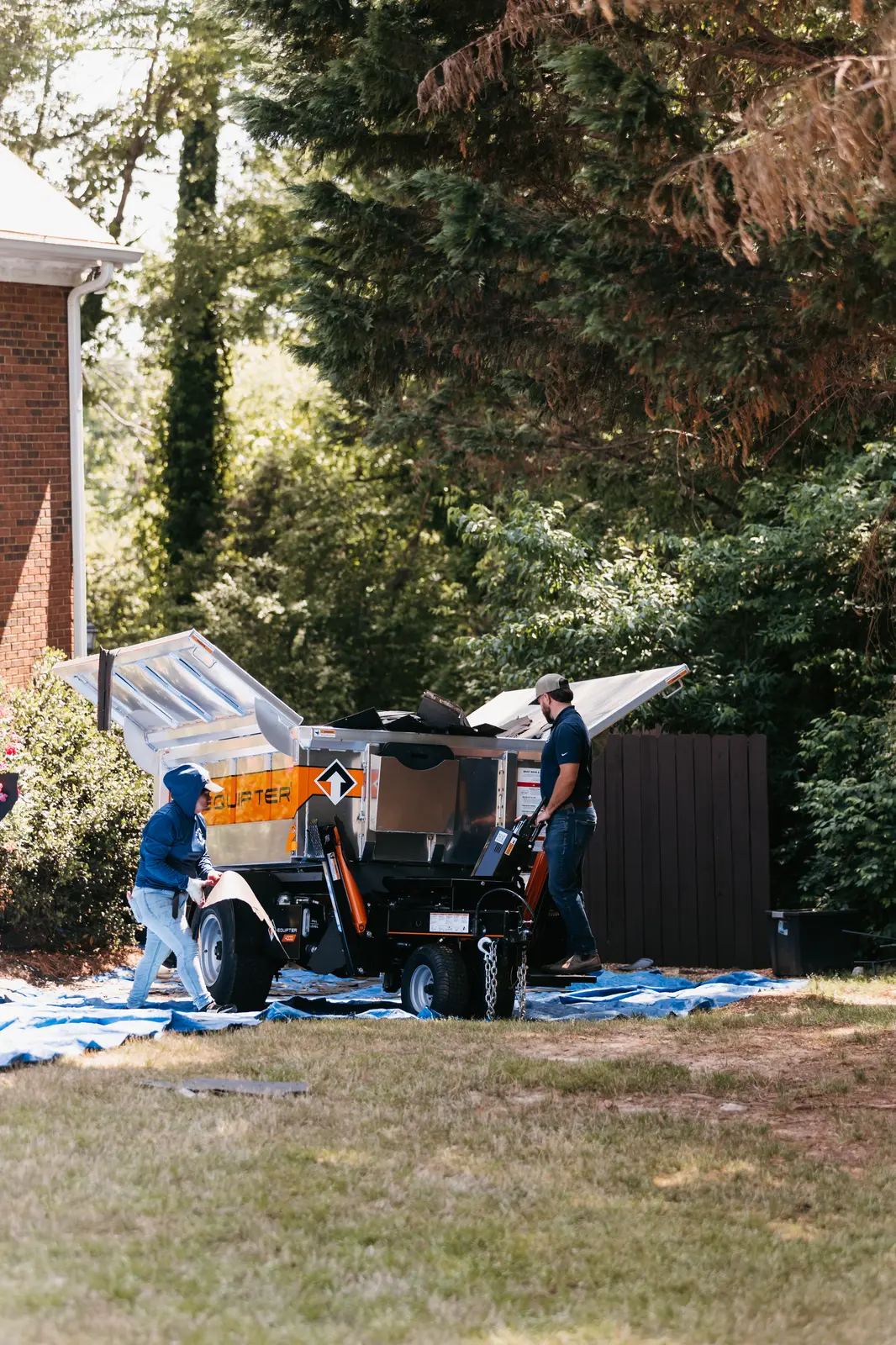 Atlanta gutter repair specialist conducting detailed inspection on a residential property