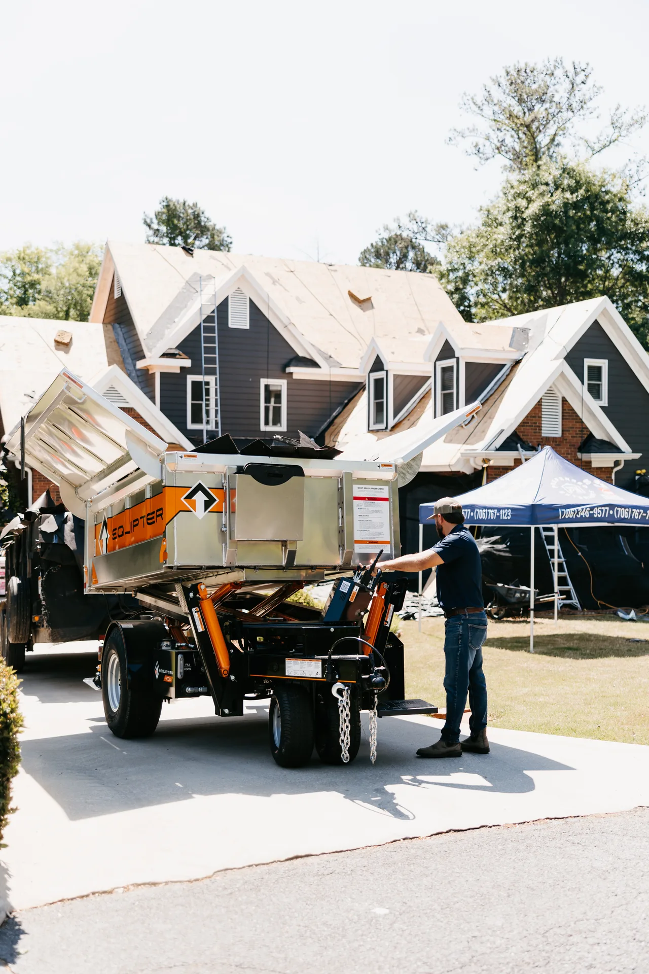 Atlanta storm restoration team responding to emergency roof damage with tarping and debris cleanup