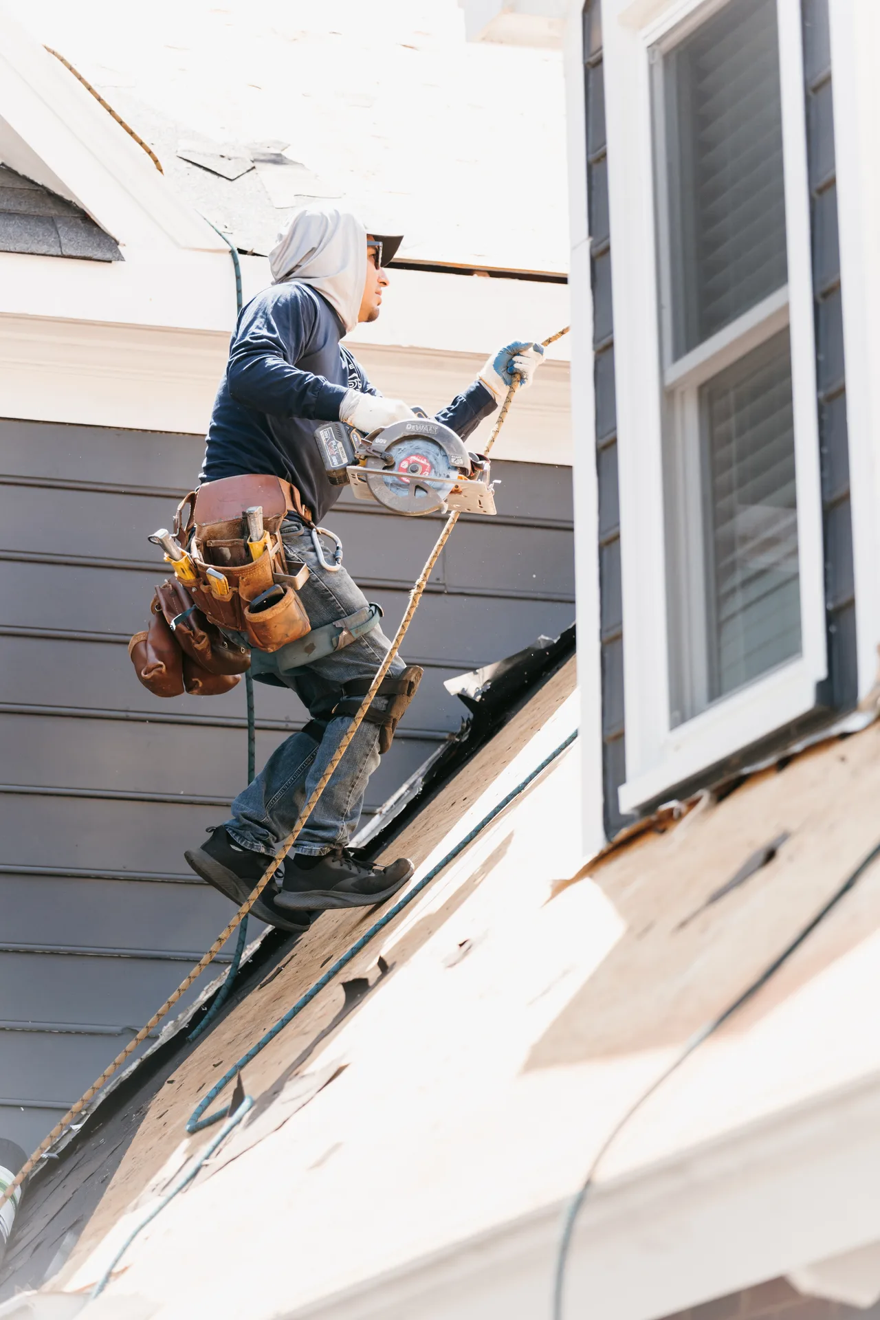 Atlanta roof repair specialist inspecting roof deck and identifying leak source on a residential home