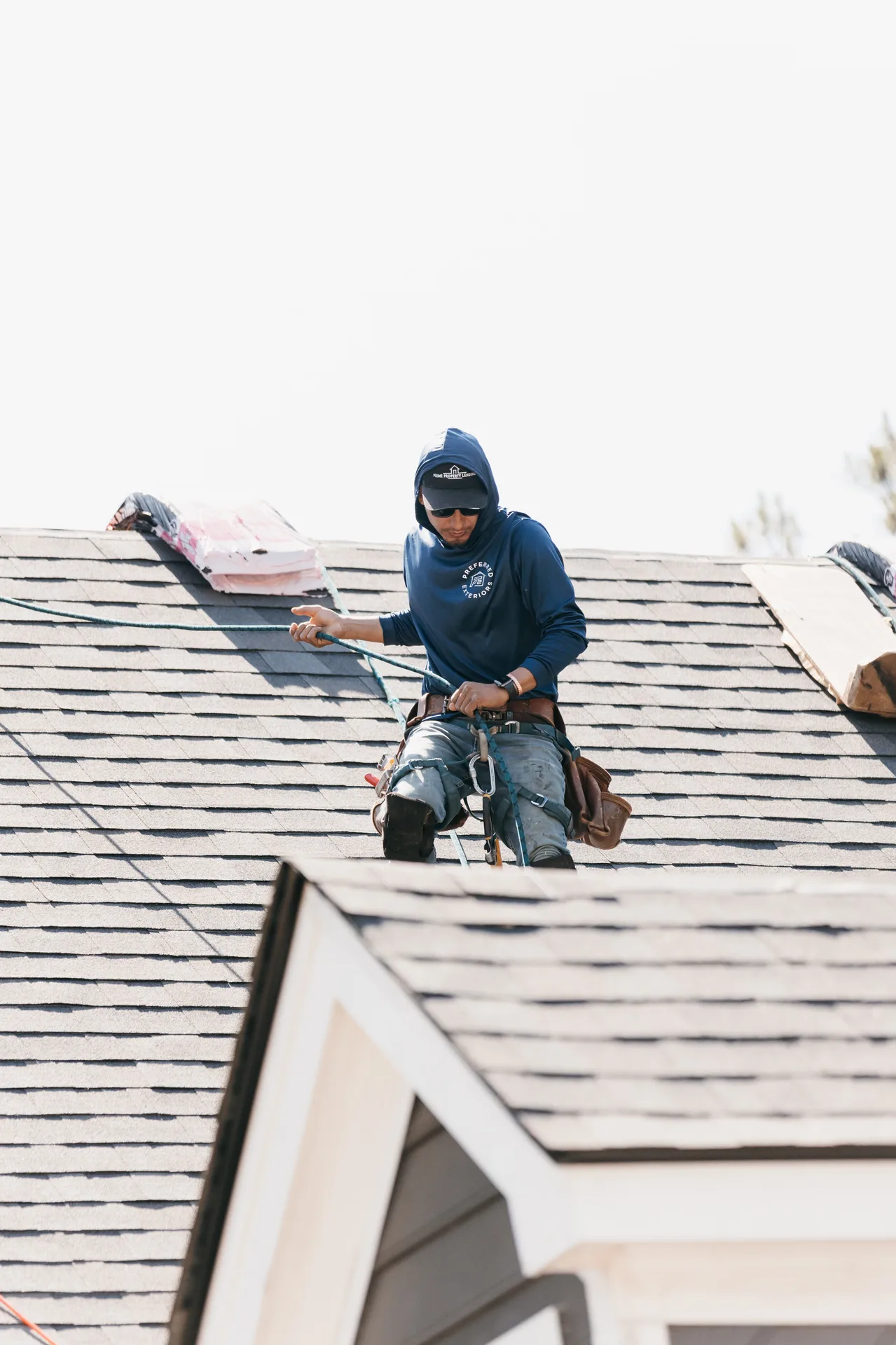 Expert roof replacement project in progress on an Atlanta, GA home by certified Preferred Roofing crew
