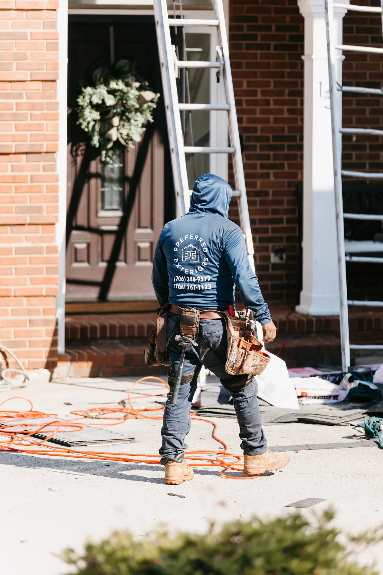 Preferred Roofing & Exteriors team helping an Atlanta homeowner choose new shingles