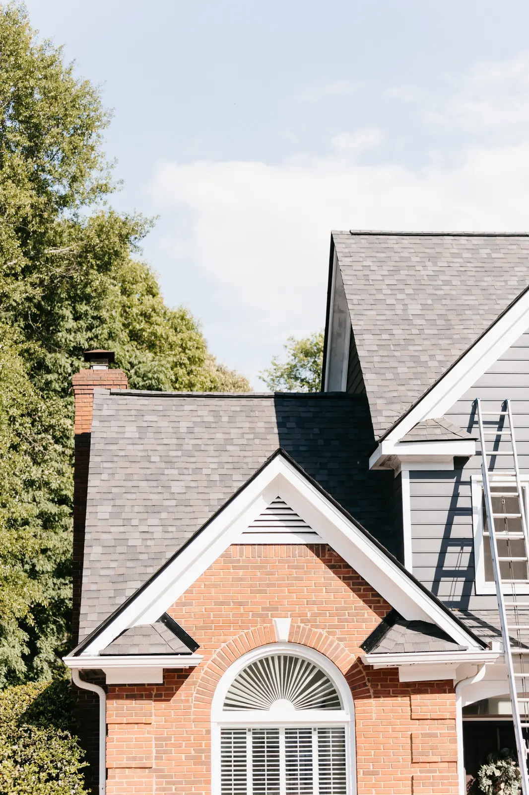Preferred Roofing & Exteriors gutter installation specialist on an Atlanta jobsite