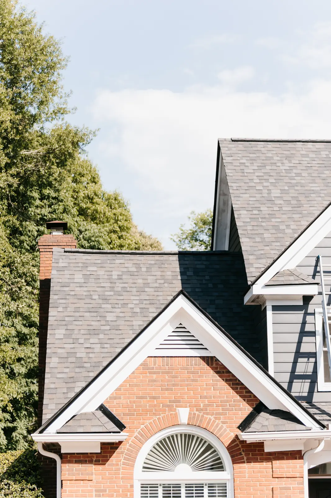 Preferred Roofing & Exteriors maintenance specialist on an Atlanta property with inspection report