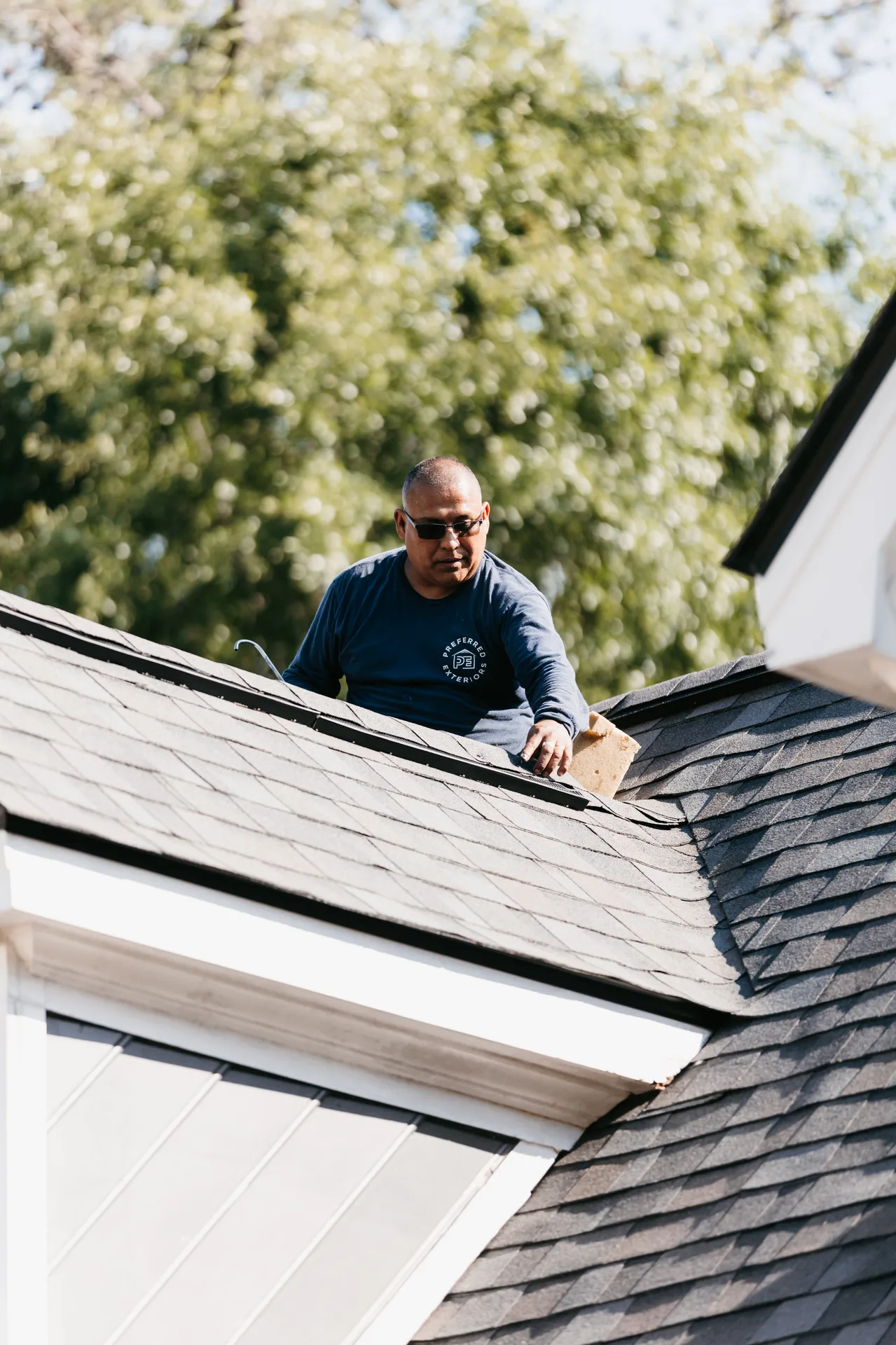 Seamless aluminum gutter installed along the edge of a residential roof