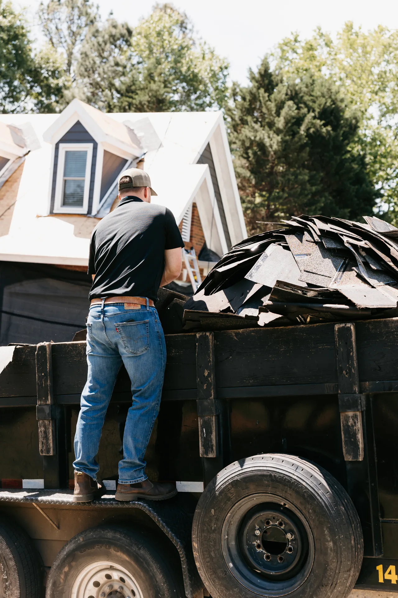 Roofer performing a video inspection on a residential roof