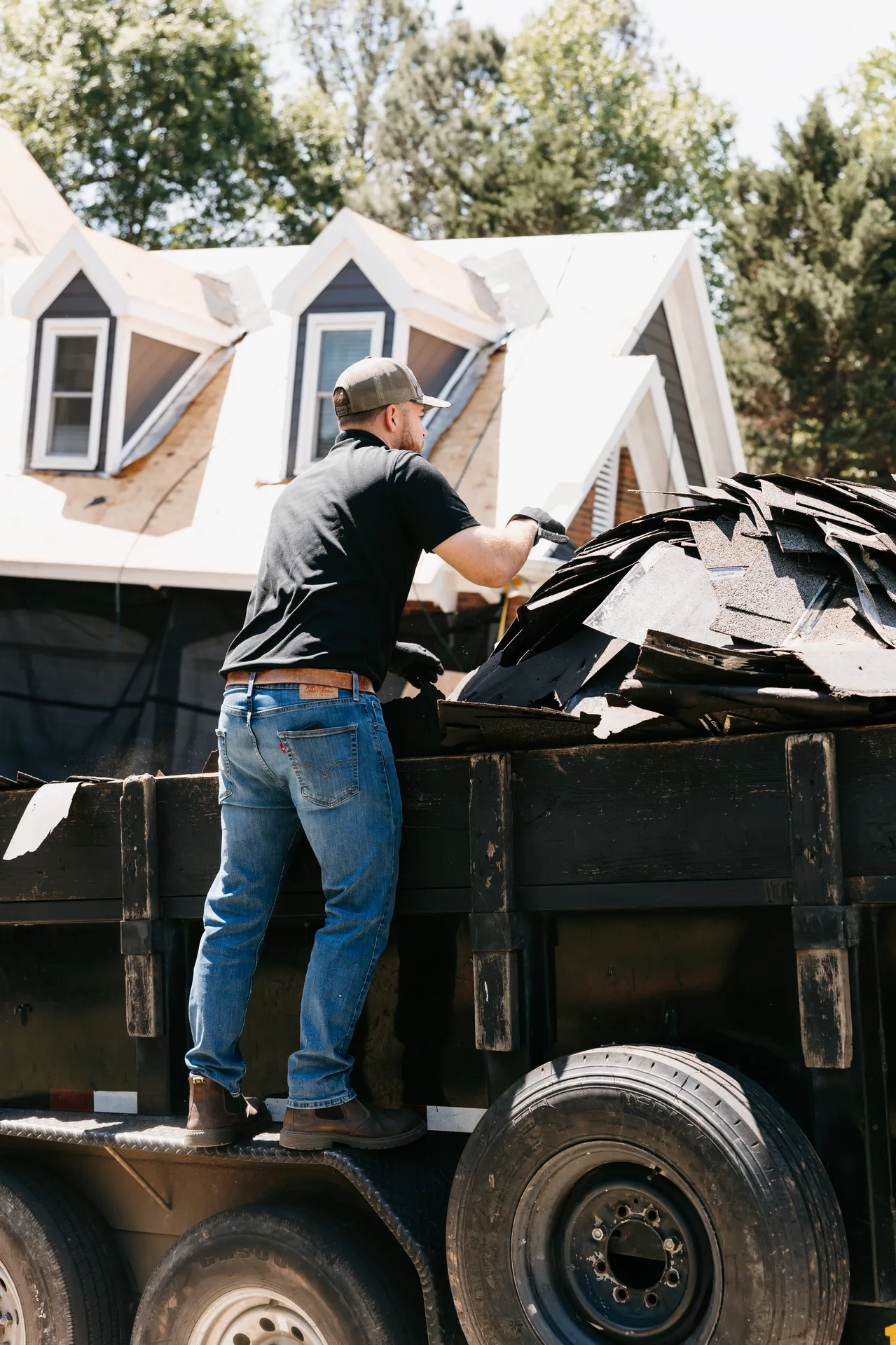 Roofing crew installing shingles on a Greater Atlanta home