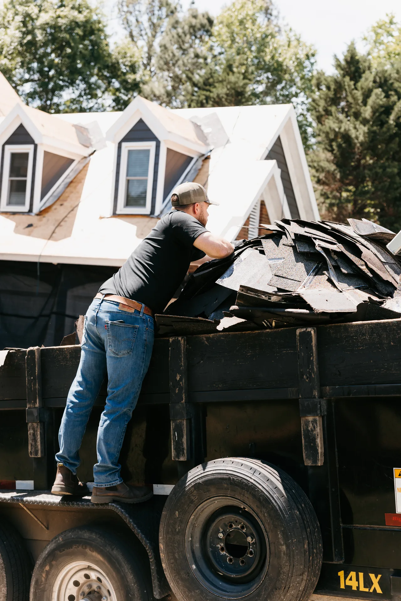 Preferred Roofing & Exteriors crew installing architectural shingles on an Atlanta home