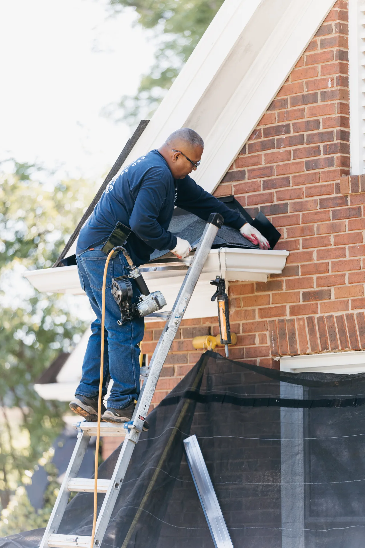 Completed roof, gutter, and siding installation on a residential home
